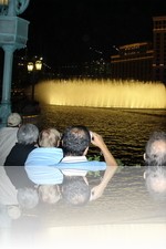 Men balding while watching the Bellagio Fountains
